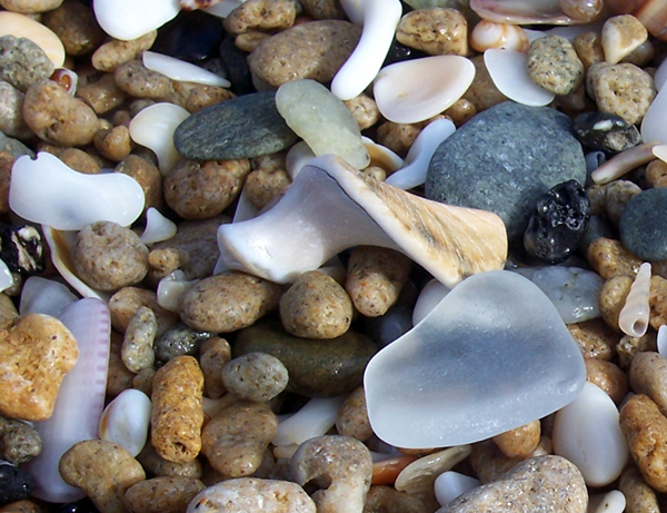 white sea glass and shingle at the beach in East London